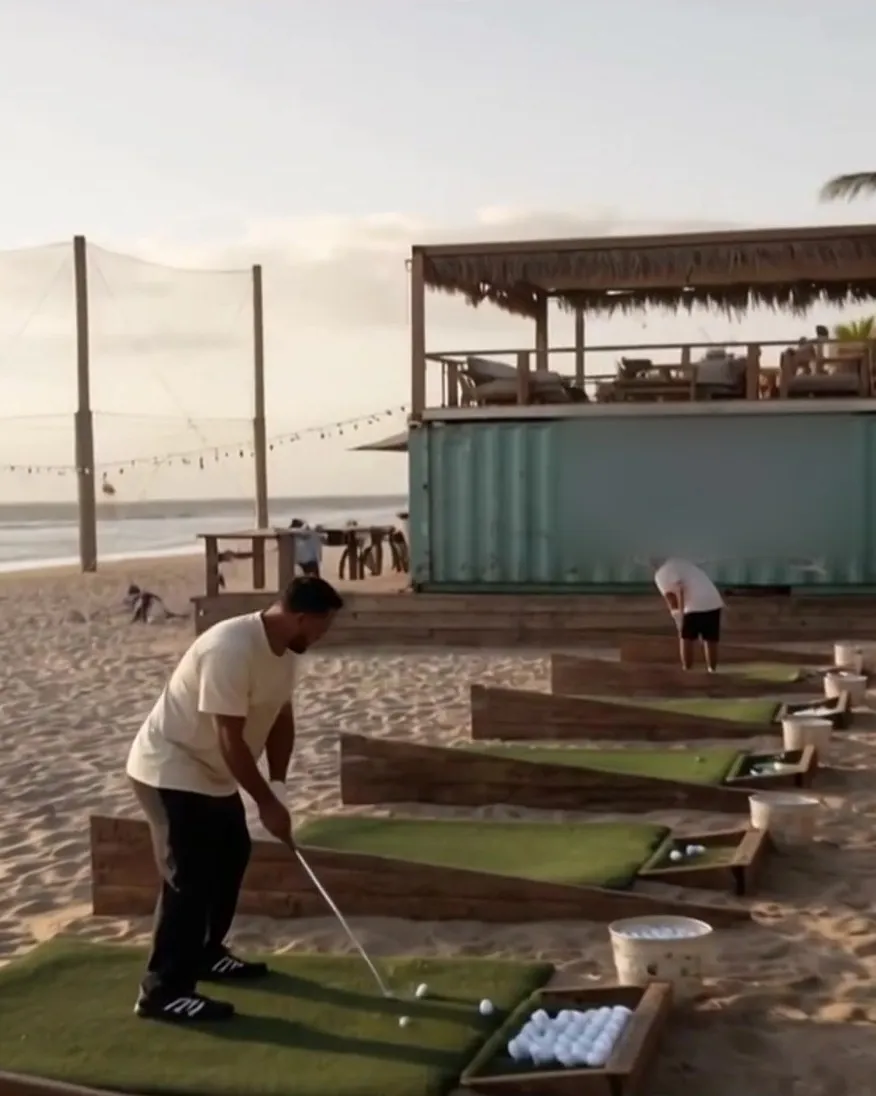 Artist's rendering of the golf project: hitting bays on the sand facing the sea, with a beach bar behind them